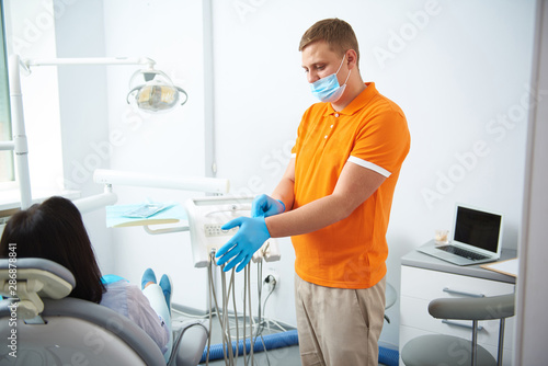 Woman is speaking with dentist in room