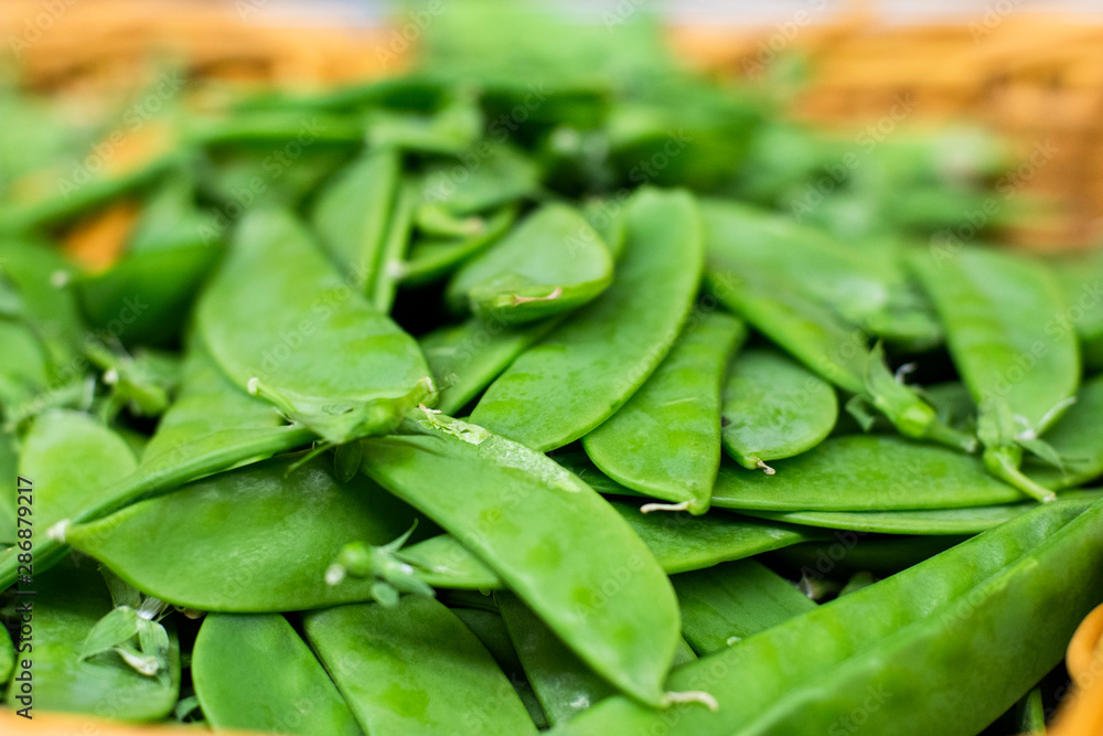 Fresh green peas piled on the market. Food backgroumd. Harvest Fresh green peas piled on the market. Food backgroumd. Harvest