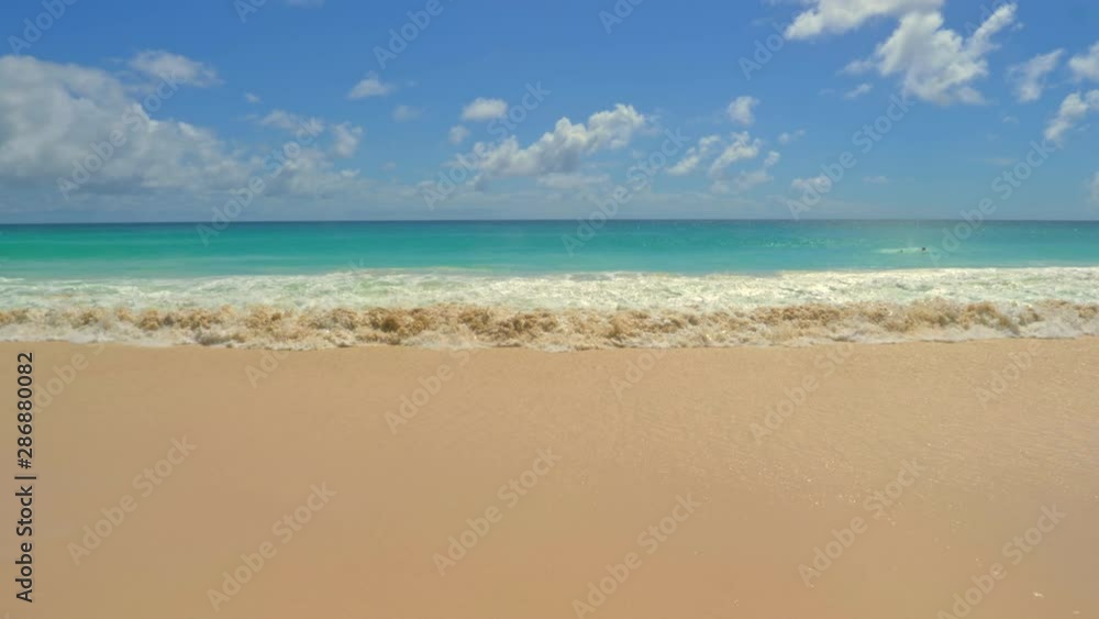 Ocean Waves on the Beach in a Sunny Day Ocean Waves on the Beach in a Sunny Day