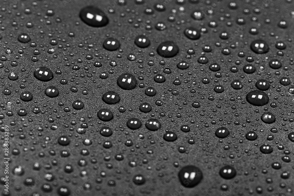 abstract water drops on a dark black background abstract water drops on a dark black background