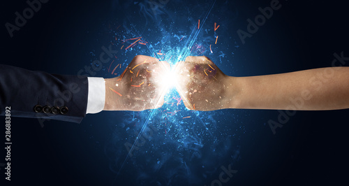 Two hands fighting with light, glow, spark and smoke concept