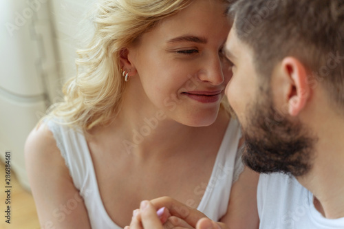 Beautiful young lady looking at her boyfriend