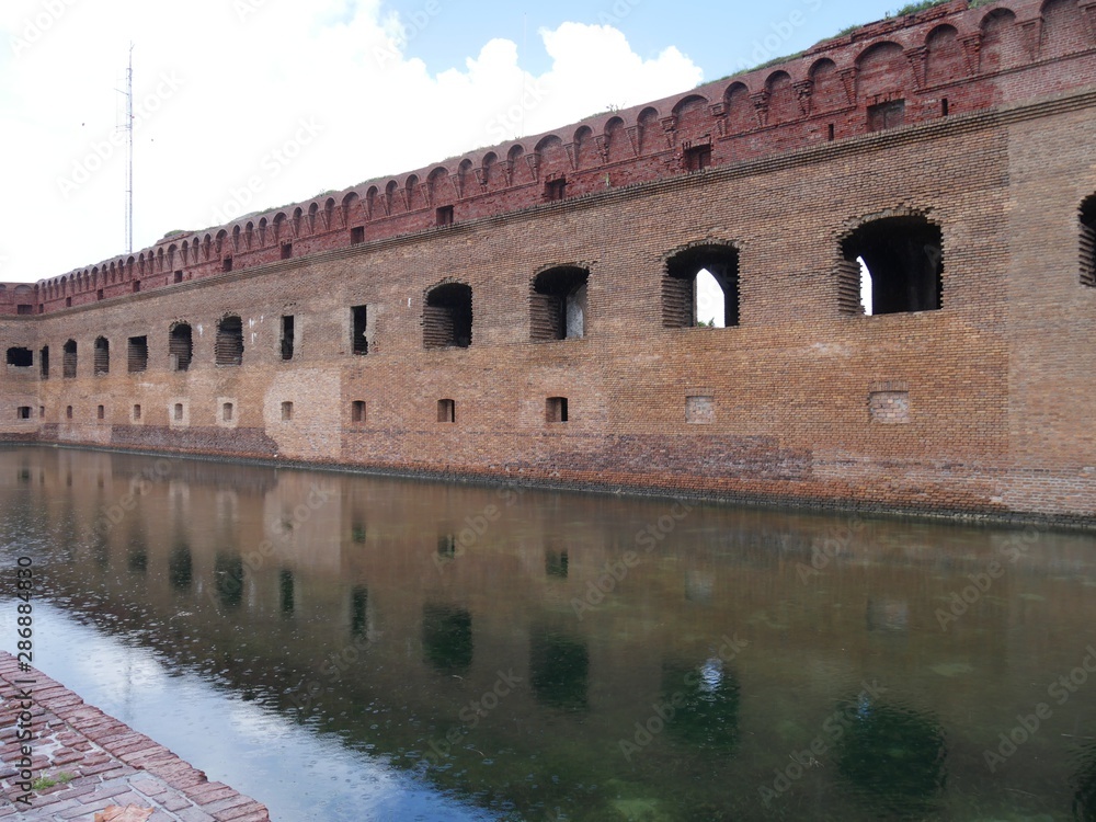 Fort Jefferson reflected in the waters of the moat at the Dry Tortugas National Park, Florida.