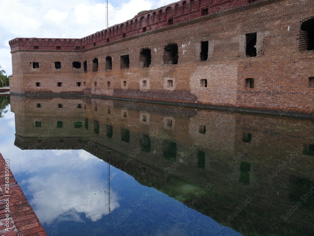 Fort Jefferson reflected in the waters of the moat at the Dry Tortugas National Park, Florida.