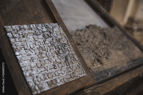 Printing press letter blocks in wooden shelf Printing industry