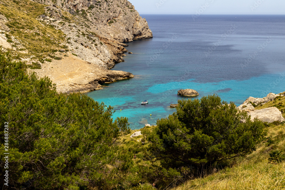 Scenic view on wonderful  rocky bay Cala Figuera on balearic island Mallorca, Spain on a sunny day with clear turquoise water in different colors