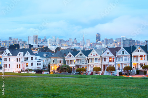 Photography Traditional Victorian Houses at Alamo Square and downtown skyline, San Francisco