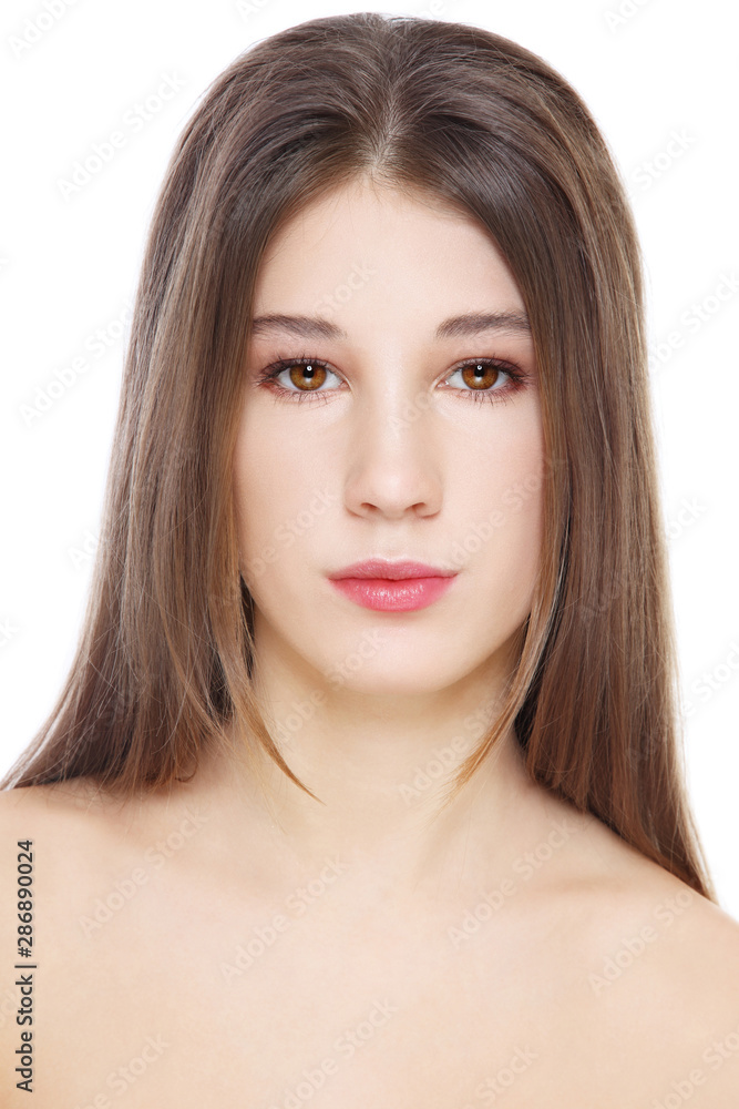 Obraz premium Portrait of young beautiful girl with long hair and clean makeup