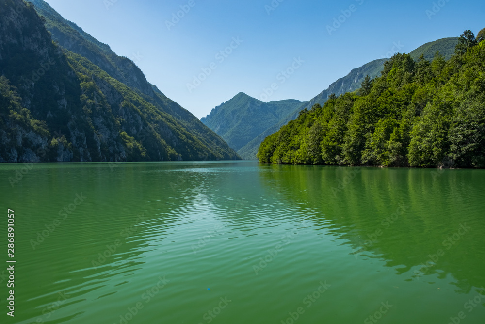 Lake in mountains with green clean water