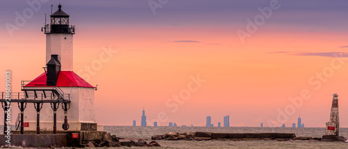 Obraz na płótnie Michigan City, Indiana / USA 05/21/2019: Lighthouse During golden Hour with Chicago in the background