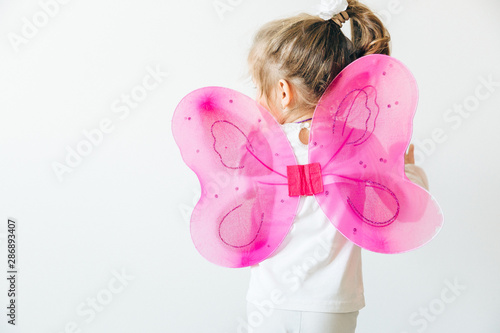 girl with pink butterfly wings