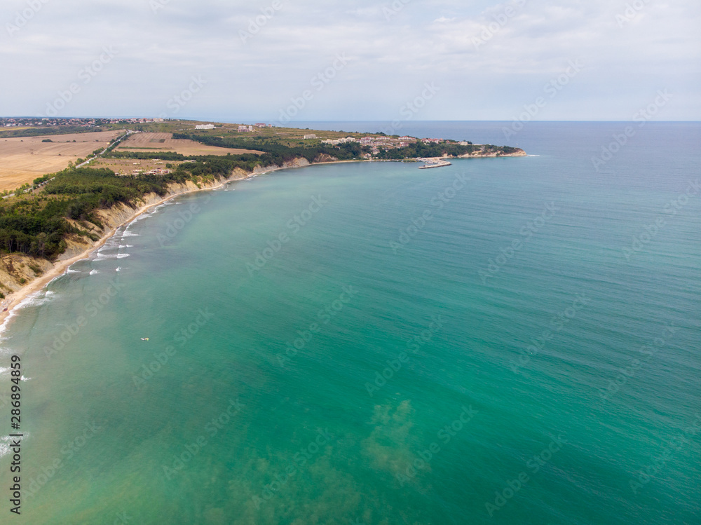 Aerial photo of the beautiful small town and seaside resort of known as Obzor in Bulgaria taken with a drone on a bright sunny day showing the beach and ocean sea front. Aerial photo of the beautiful small town and seaside resort of known as Obzor in Bulgaria taken with a drone on a bright sunny day showing the beach and ocean sea front.