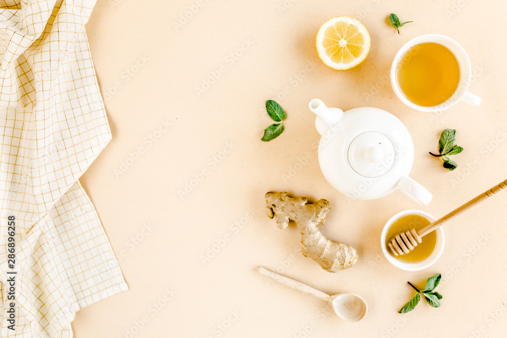 Herbal tea with mint, ginger, lemon, honey and other herbs on yellow background. Flat lay, top view. Herbal tea with mint, ginger, lemon, honey and other herbs on yellow background. Flat lay, top view.