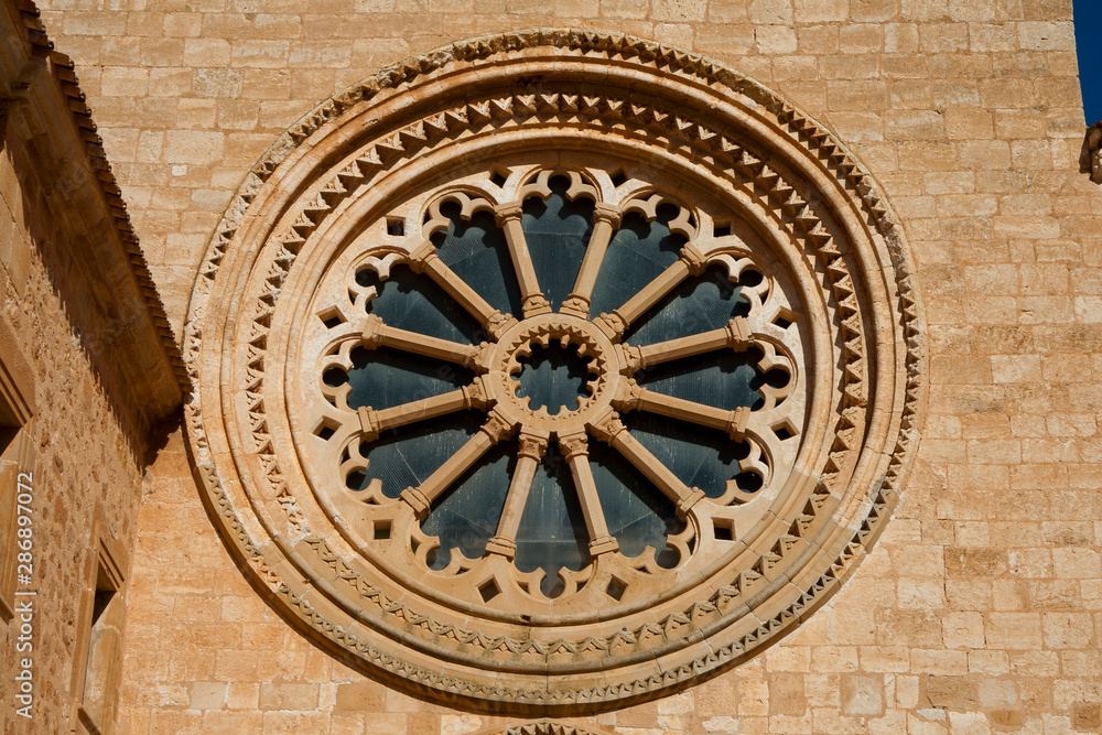 Glass and stone rosette front view in a monsatery.