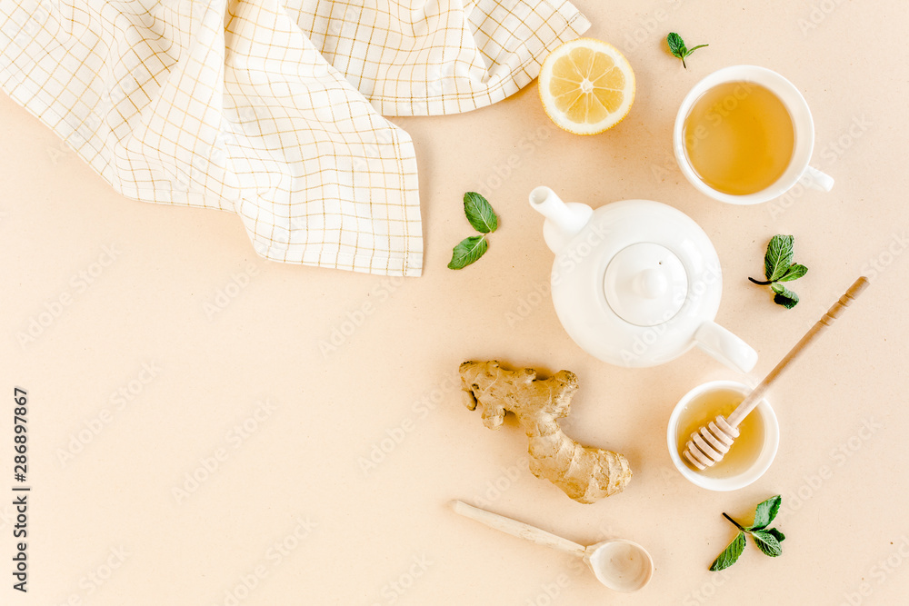 Herbal tea with mint, ginger, lemon, honey and other herbs on yellow background. Flat lay, top view. Herbal tea with mint, ginger, lemon, honey and other herbs on yellow background. Flat lay, top view.