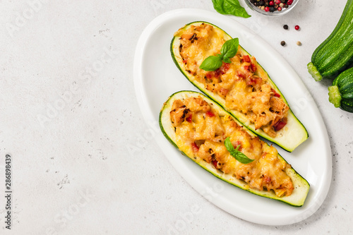 Lazagna zucchini boats. Top view, space for text.