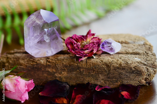 Beautiful Amethyst tower, lots of rainbows. Beautiful polished amethyst tower. Bright Quartz crystal, healing crystal being held in hand. Woman holding amethyst tower, natural lighting, reiki energy