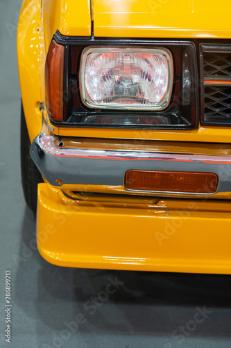 Close up Color detail on the headlight of a vintage car