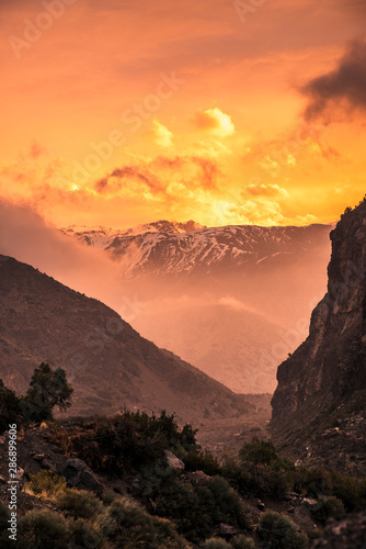 Sunset looking at snowy mountain tops during winter in Cajon Del Maipo, Chile. 