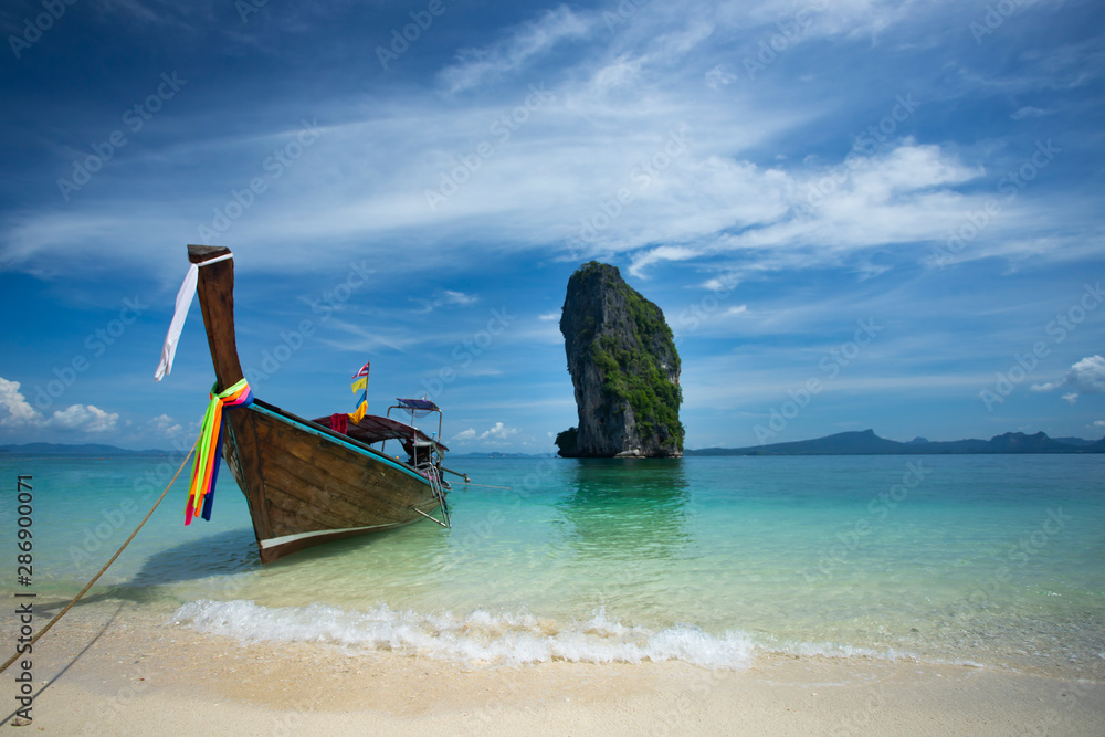 Traditional longtail boat and Poda island, Thailand. Traditional longtail boat and Poda island, Thailand.