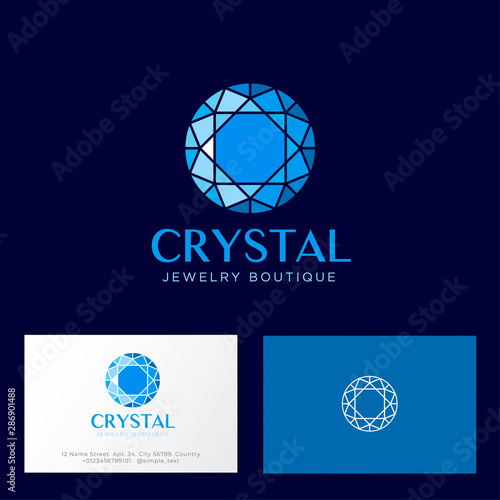 Crystal logo. Faceted gem blue crystal and letters on a dark background. Identity. Business card.