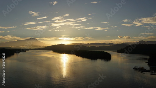 Mount Kinabalu during sunrise over Sulaman River Bridge photo