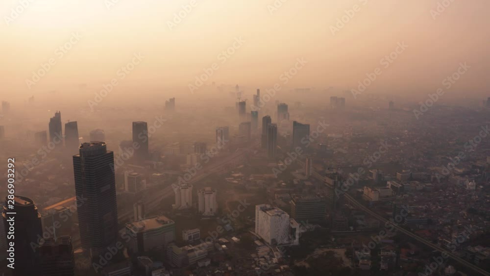 JAKARTA, Indonesia - August 27, 2019: Aerial landscape of Jakarta skyline with dangerous air pollution above the city. Shot in 4k resolution from a drone flying forwards JAKARTA, Indonesia - August 27, 2019: Aerial landscape of Jakarta skyline with dangerous air pollution above the city. Shot in 4k resolution from a drone flying forwards