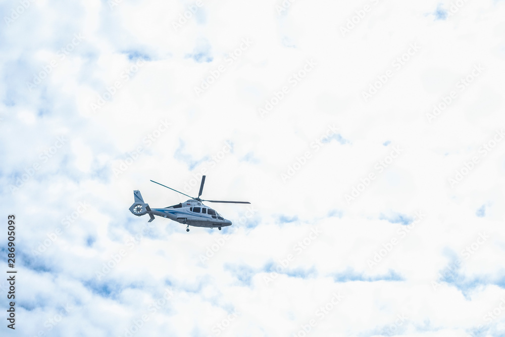 St. Petersburg, Russia - August, 14, 2019: helicopter flies in the sky over St. Petersburg St. Petersburg, Russia - August, 14, 2019: helicopter flies in the sky over St. Petersburg