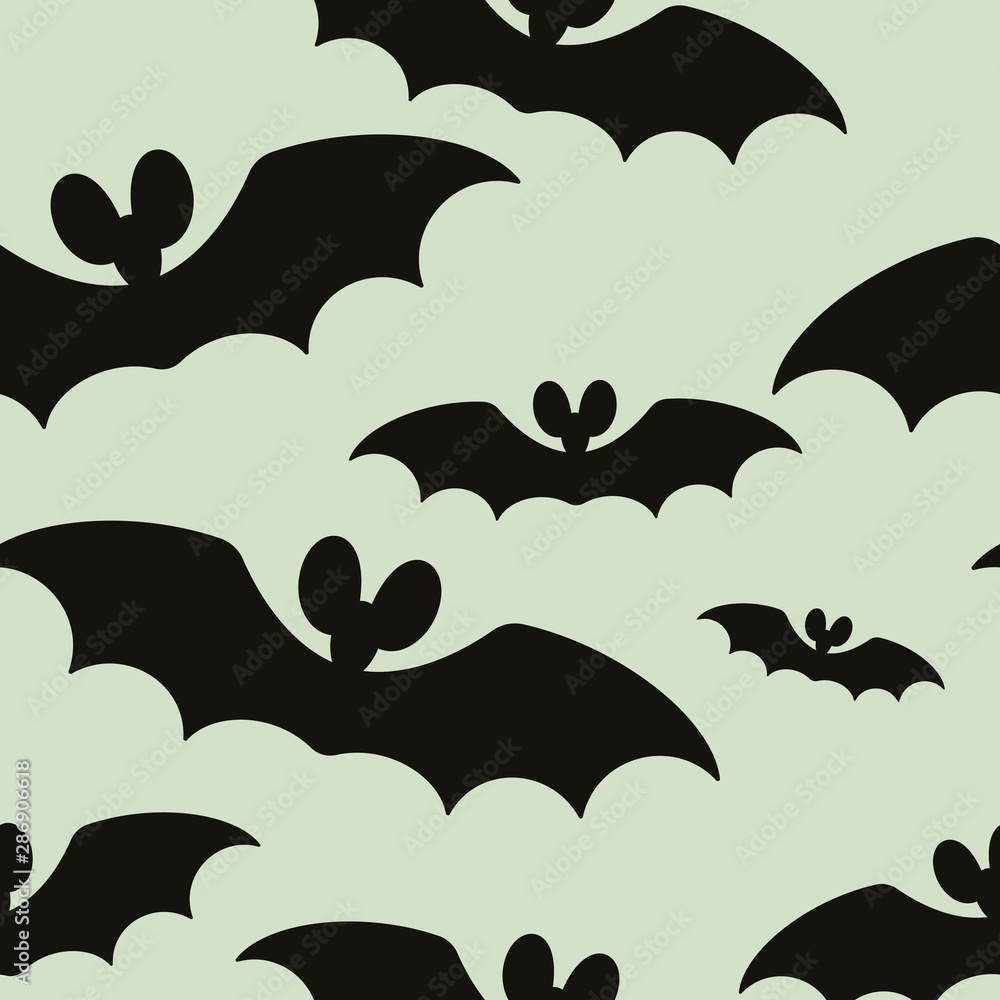 The seamless pattern with the silhouettes of bats is on a gray background. The seamless pattern with the silhouettes of bats is on a gray background.