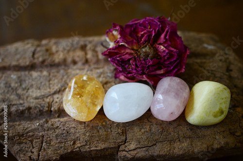 Positivity Crystals, Mindfulness. Tumbled Crystal Bundle: Rose Quartz, Citrine, Serpentine, and Milky Quartz. Energy Spring Cleaning. Variety of healing crystals, pastel colors in natural lighting