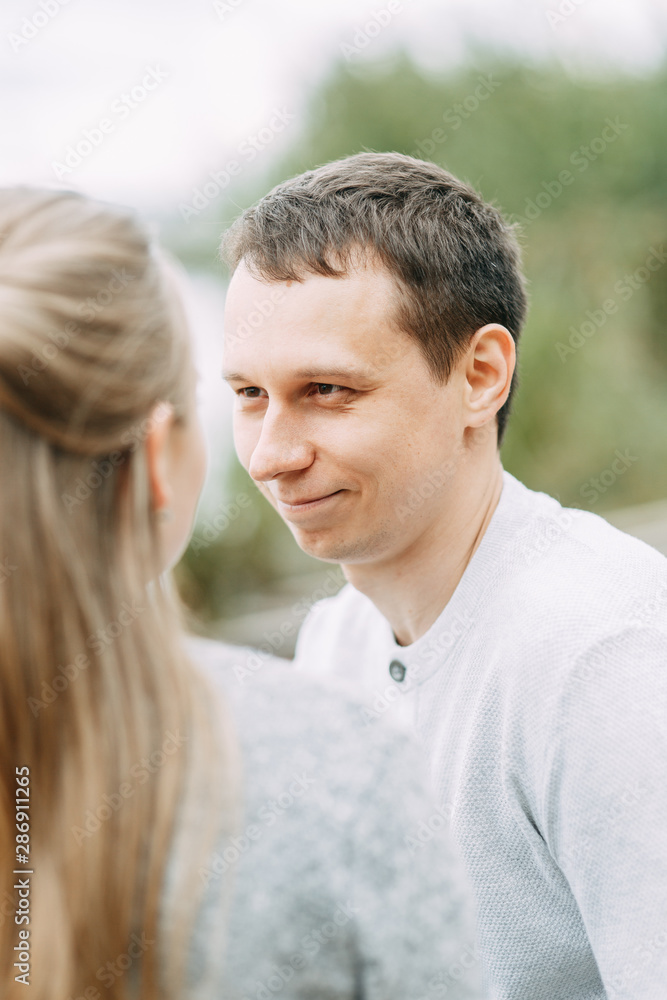 journey outdoors in the summer. smiling portrait of a man on the lake. journey outdoors in the summer. smiling portrait of a man on the lake.
