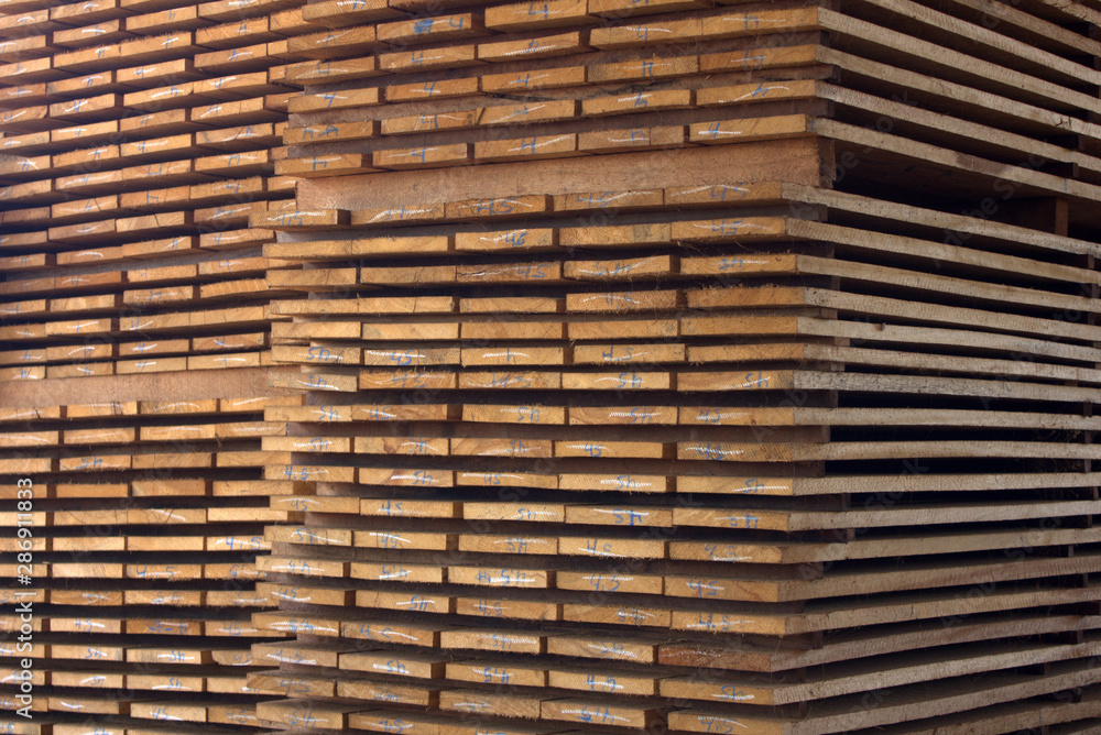 Stacks of packed lumber (boards) ready for sale to the final consumer Stacks of packed lumber (boards) ready for sale to the final consumer