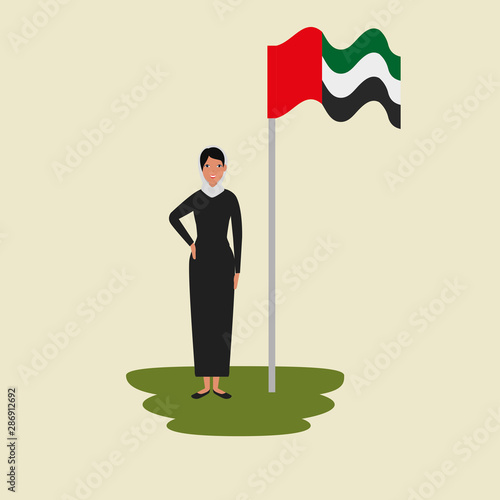 islamic woman with traditional burka and arabia flag in pole