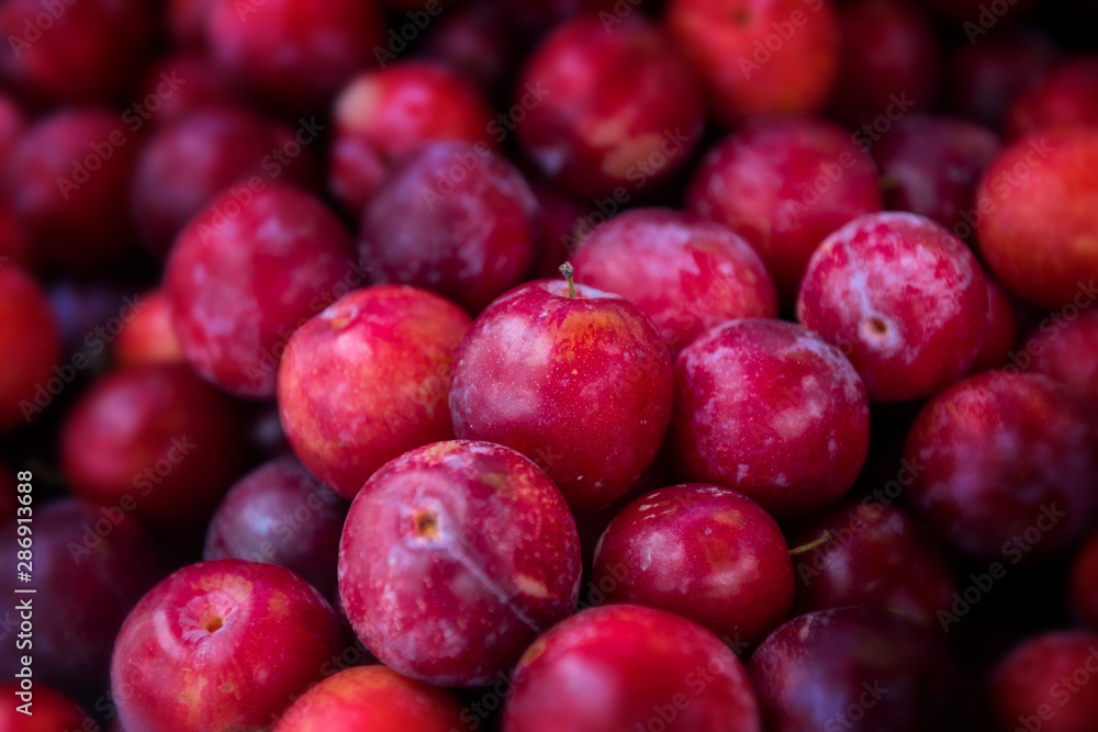 Plum fruits group in the market.