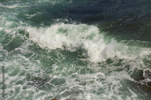 Waves during a storm. View from above. Red code. Rest on the Black Sea coast in Bulgaria. Elemental force.