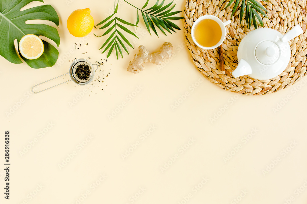 Herbal tea with mint, ginger, lemon, honey and other herbs on yellow background. Flat lay, top view. Herbal tea with mint, ginger, lemon, honey and other herbs on yellow background. Flat lay, top view.
