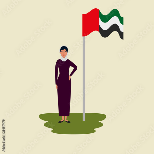 islamic woman with traditional burka and arabia flag in pole