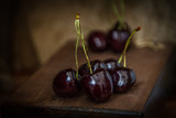 Natural cherry in a basket and on a black background.