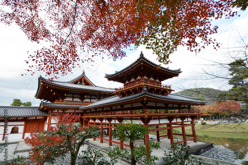 Buddhist Temple in Kyoto Japan with Red Maple Trees