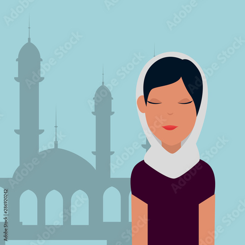 islamic woman with traditional burka and mosque building