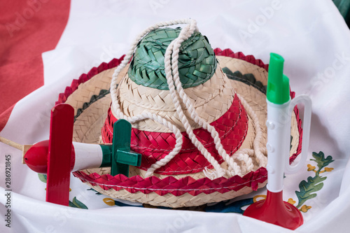Obraz na płótnie Hat, noisemaker and trumpet, accessories for Mexican Independence Day celebratio
