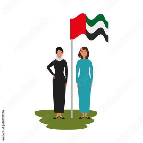 islamic women with traditional burka and arabia flag in pole