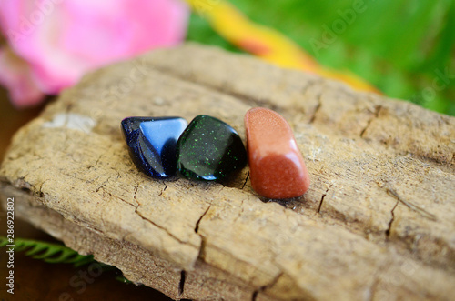 Tumbled Red Goldstone, Blue Goldstone, and Green Goldstone! Sparkling healing crystals, magical witchy stones for reiki healing and energy work! Rainbow of tumbled stones natural lighting photoagraphy