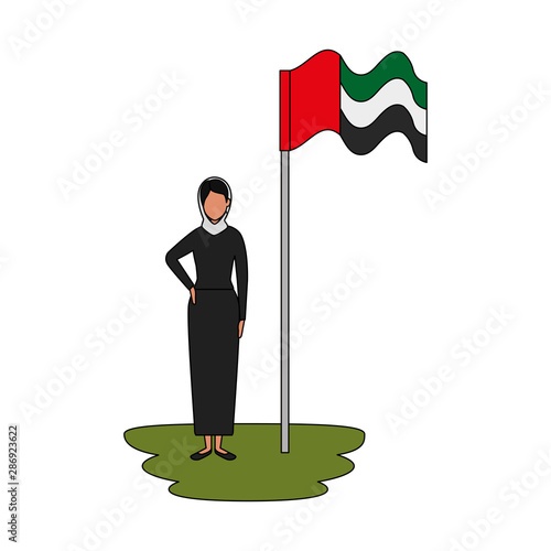 islamic woman with traditional burka and arabia flag in pole