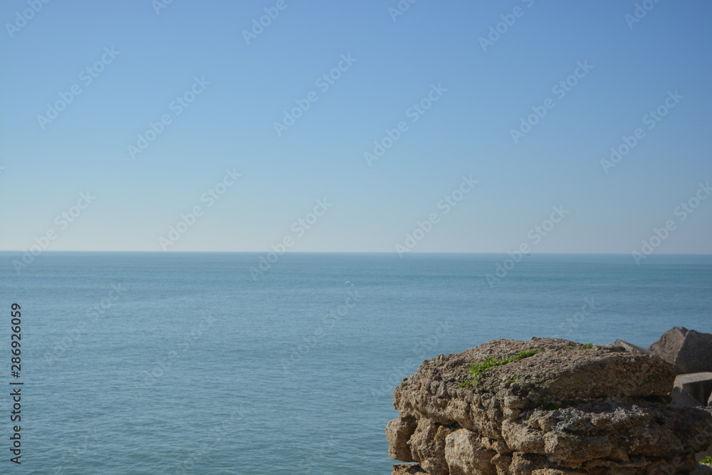 A view of the Mediterranean sea with a clear blue sky over it
