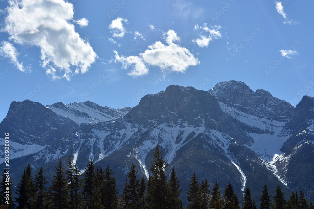 Snow-covered Rocky Mountains on a Summer Day