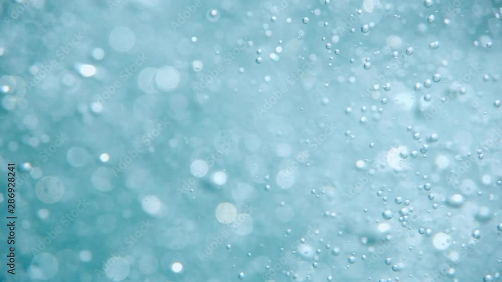 Bubbles rising to the surface. Air bubbles in water in sea (underwater shot), good for backgrounds. Slow motion. Bubbles rising to the surface. Air bubbles in water in sea (underwater shot), good for backgrounds. Slow motion.