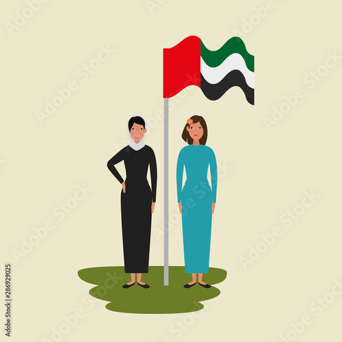islamic women with traditional burka and arabia flag in pole