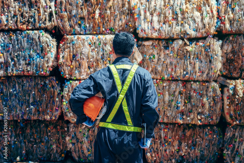 Engineer Standing and looking back The plastic bottle in the recycling industry