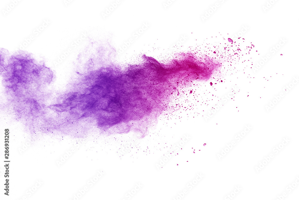 Freeze motion of purple color powder exploding on white background. Freeze motion of purple color powder exploding on white background.